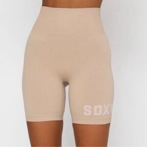White Fox X Sarah’s Day tan rubbed biker shorts.